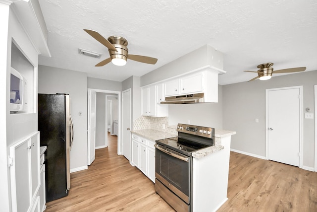 619 Shenandoah Dr, Shenandoah, TX 77381 - kitchen with under cabinet range hood, a ceiling fan, visible vents, and stainless steel appliances