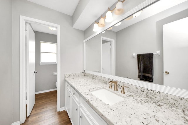 619 Shenandoah Dr, Shenandoah, TX 77381 - bathroom featuring vanity, baseboards, toilet, and wood finished floors