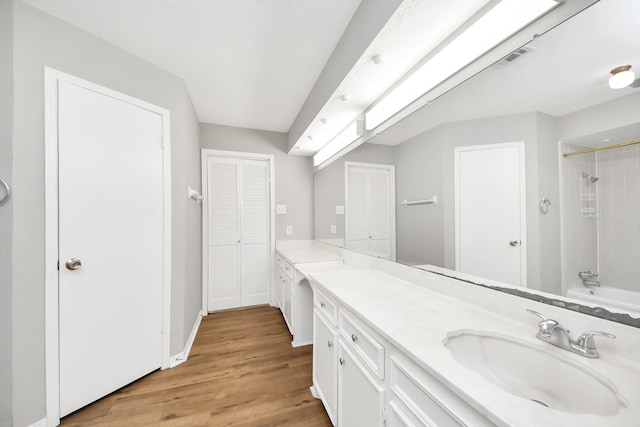 619 Shenandoah Dr, Shenandoah, TX 77381 - full bathroom featuring vanity, baseboards, visible vents, and wood finished floors
