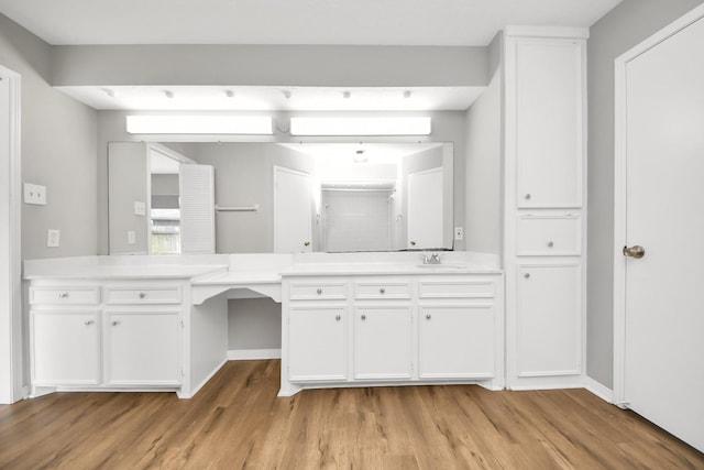 619 Shenandoah Dr, Shenandoah, TX 77381 - bathroom featuring baseboards, vanity, and wood finished floors
