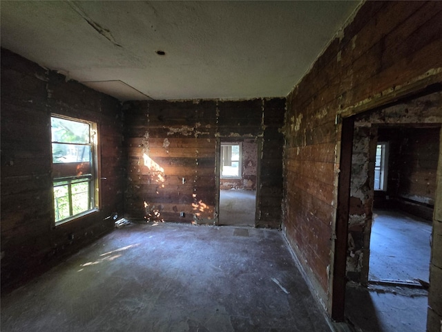 2005 Cochran St, Houston, TX 77009 - unfurnished room featuring wooden walls and a healthy amount of sunlight
