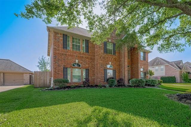 view of front of property with a garage, a front yard, fence, and brick siding