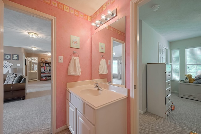 bathroom featuring vanity and baseboards