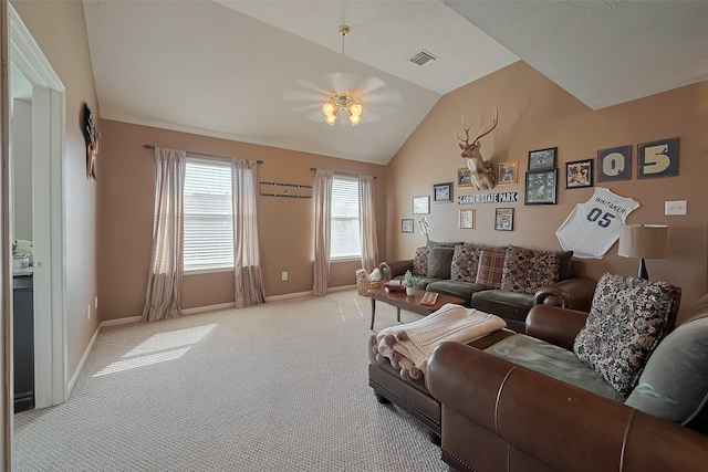 carpeted living room with ceiling fan, baseboards, vaulted ceiling, and visible vents