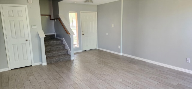 3327 Fiorella Way, Humble, TX 77338 - foyer with baseboards, wood finished floors, and stairway