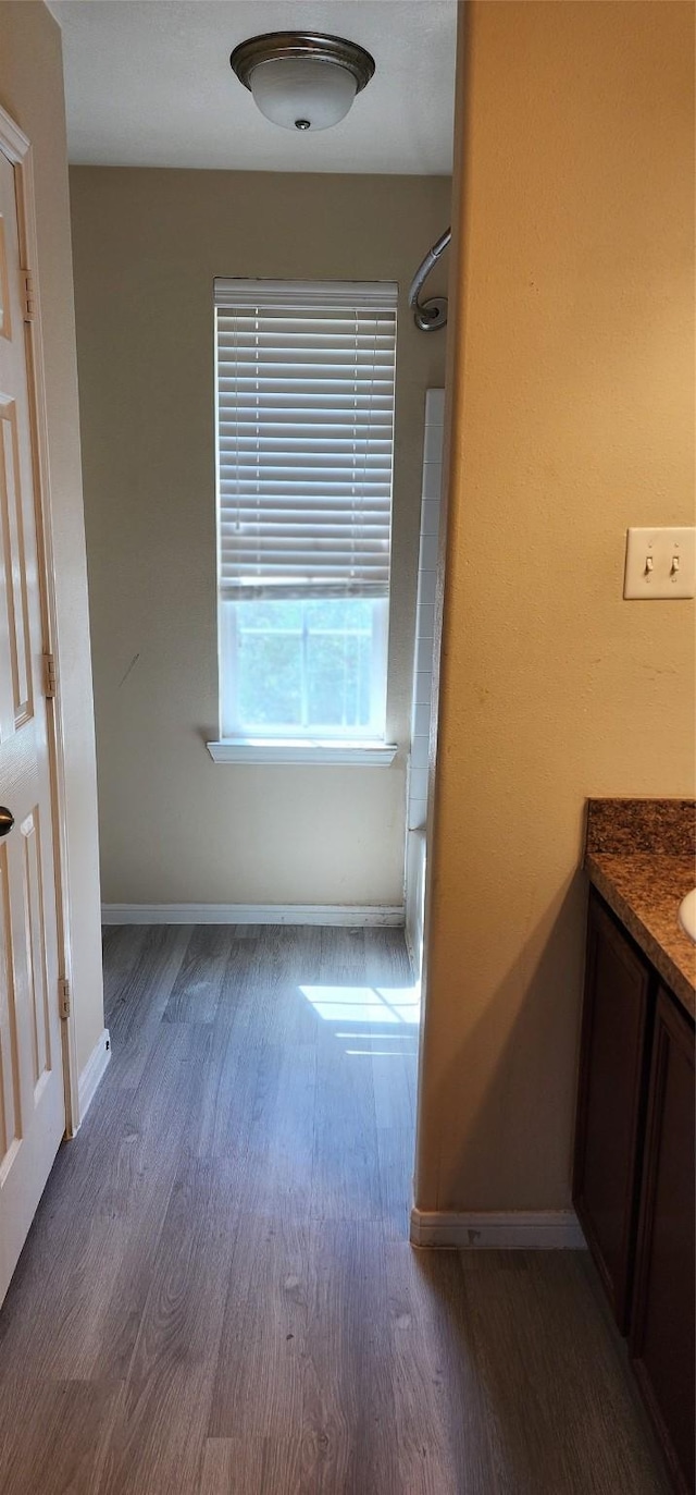 3327 Fiorella Way, Humble, TX 77338 - bathroom featuring walk in shower, baseboards, vanity, and wood finished floors