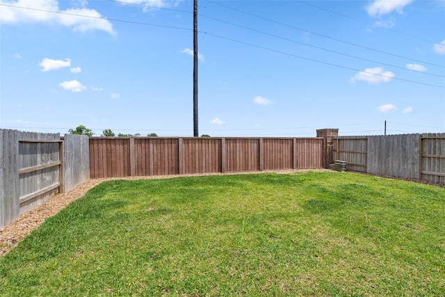 view of yard with a fenced backyard