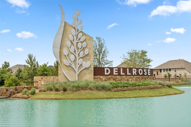 community sign with a water view