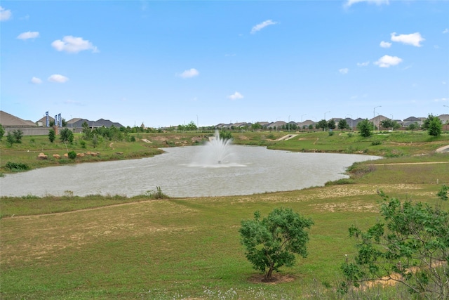 view of home's community with a yard, a residential view, and a water view