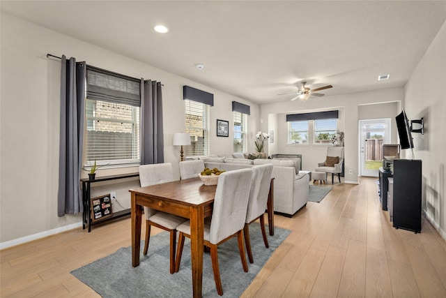 dining room featuring visible vents, baseboards, ceiling fan, light wood-style floors, and recessed lighting