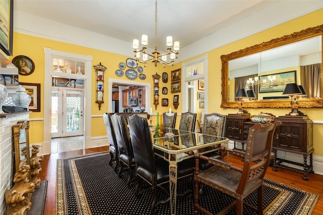 dining room featuring a chandelier and wood finished floors