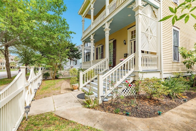 exterior space with a porch and fence