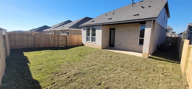 5823 Starling Dr, Baytown, TX 77521 - rear view of property featuring brick siding, a shingled roof, cooling unit, and a patio