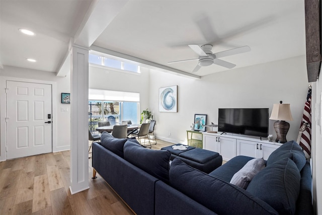 living room with light wood-style floors, ceiling fan, baseboards, and recessed lighting