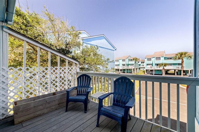 wooden terrace featuring a residential view