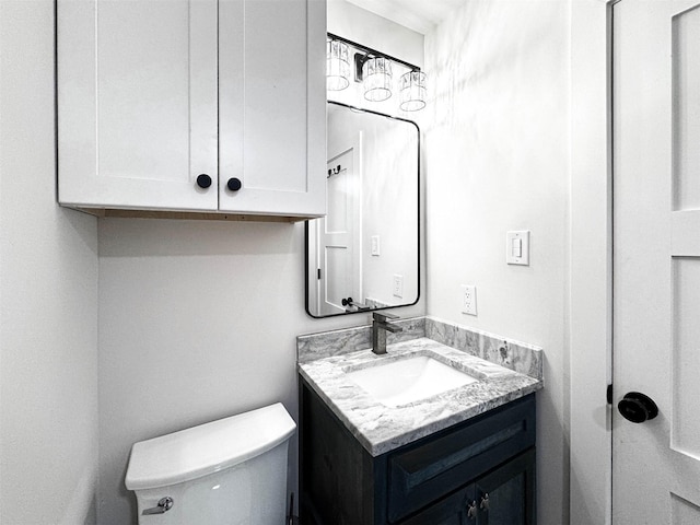 half bath with vanity and toilet