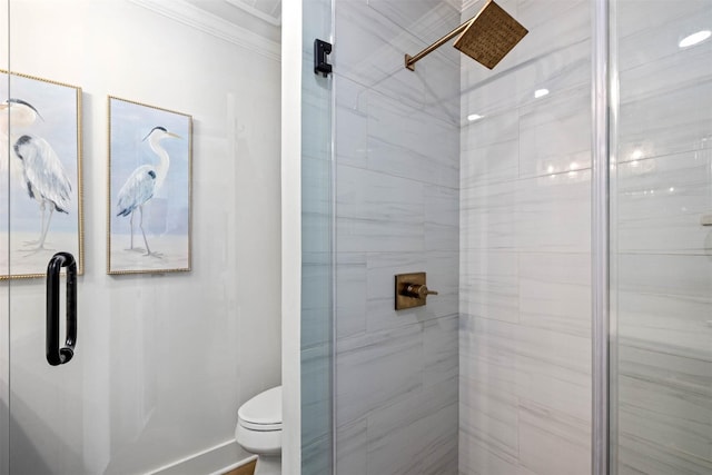 full bath with a shower stall, crown molding, and toilet