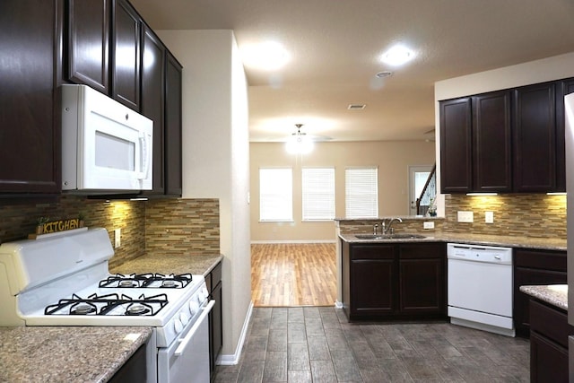 kitchen with a ceiling fan, a sink, white appliances, and plenty of natural light