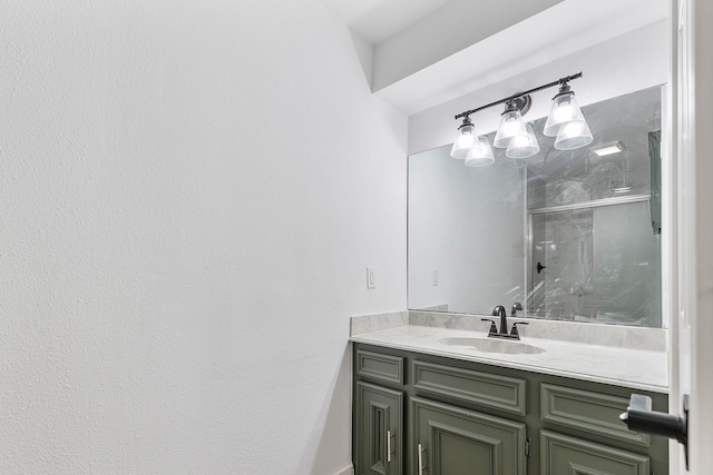 full bathroom with a shower stall and vanity