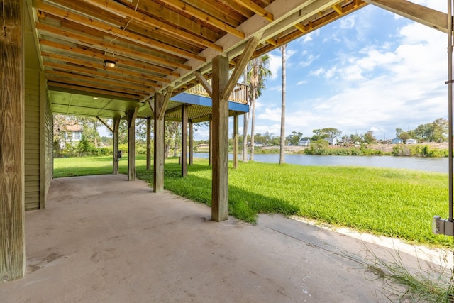 view of patio with a water view