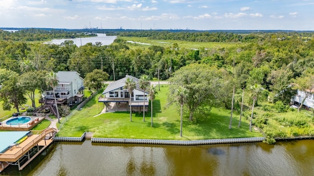 aerial view featuring a water view and a forest view