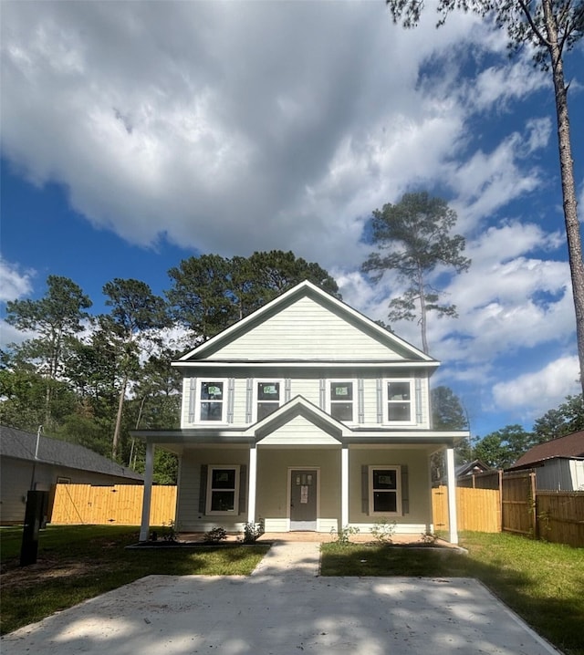 15882 Sycamore Dr, Willis, TX 77356 - view of front of property featuring a porch