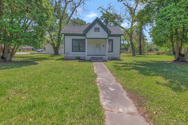 428 E Magnolia St, Angleton, TX 77515 - bungalow-style home with a porch and a front lawn