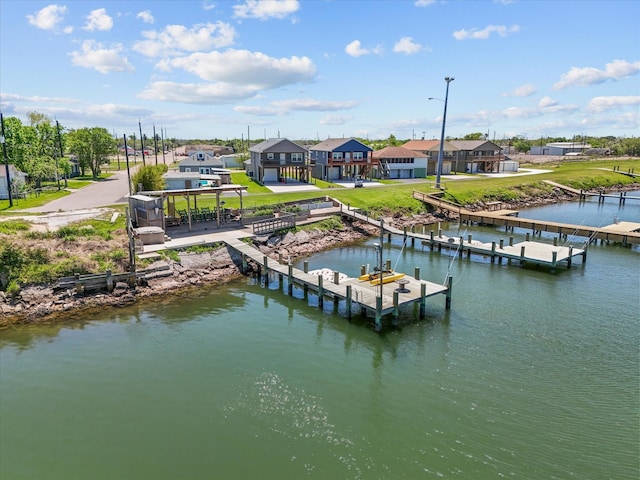 602 W 1st St, Freeport, TX 77541 - dock featuring a yard, a water view, and a residential view