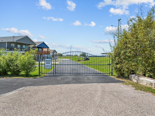 602 W 1st St, Freeport, TX 77541 - gate featuring a lawn