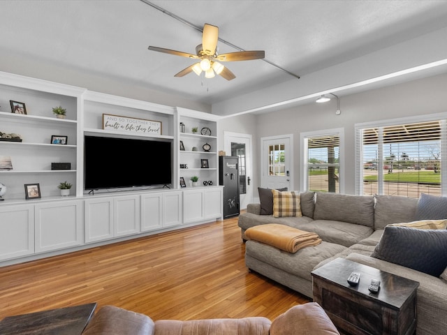 602 W 1st St, Freeport, TX 77541 - living room with light wood-style flooring and a ceiling fan