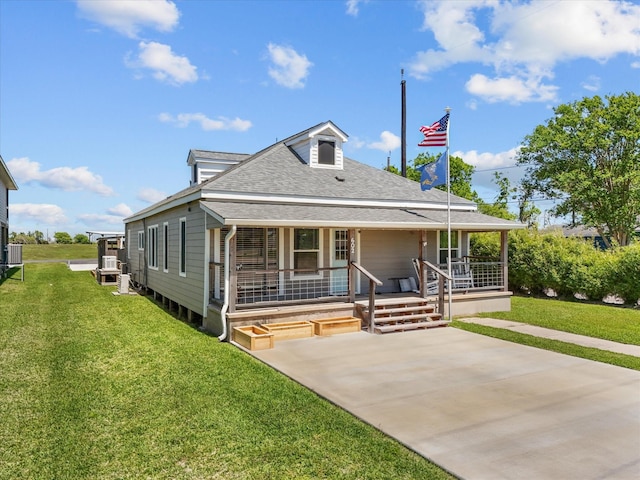 602 W 1st St, Freeport, TX 77541 - view of front of property with a porch, a shingled roof, and a front yard