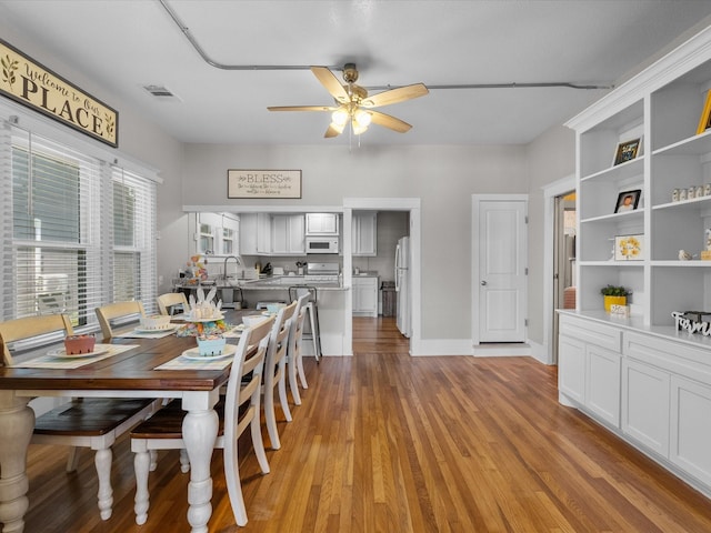 602 W 1st St, Freeport, TX 77541 - dining room with a ceiling fan and light wood-type flooring