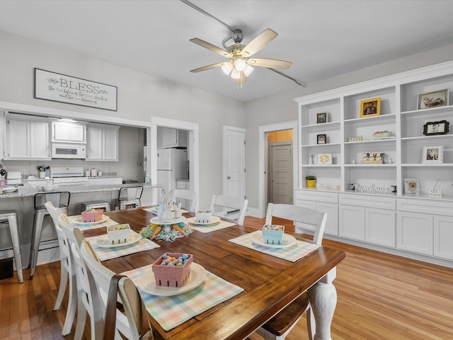 602 W 1st St, Freeport, TX 77541 - dining space with a ceiling fan and light wood finished floors