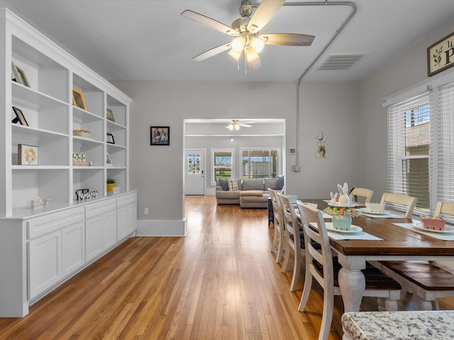 602 W 1st St, Freeport, TX 77541 - dining area with ceiling fan and light wood-style flooring