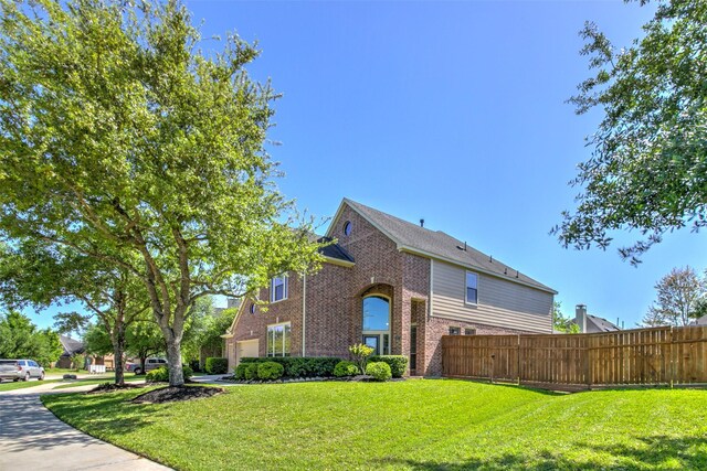6103 Silver Thistle Ln, Fulshear, TX 77441 - view of property exterior with brick siding