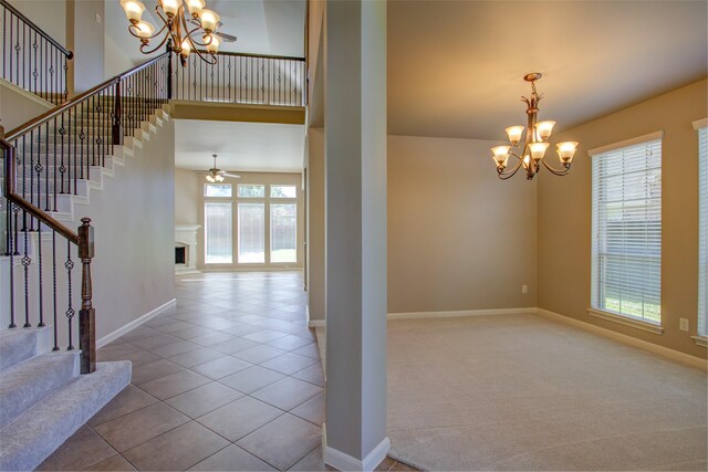 6103 Silver Thistle Ln, Fulshear, TX 77441 - interior space with a chandelier, plenty of natural light, stairway, and a high ceiling