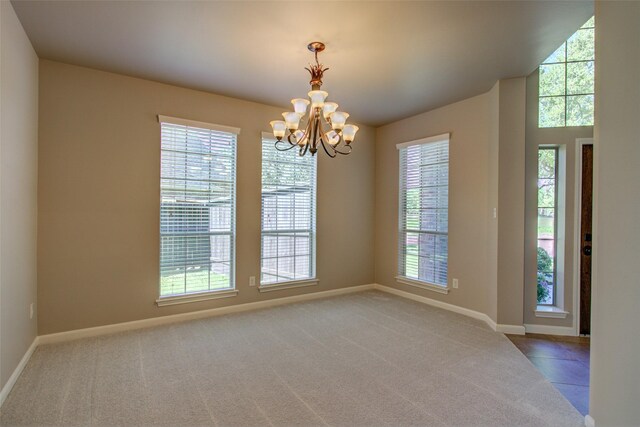 6103 Silver Thistle Ln, Fulshear, TX 77441 - carpeted empty room featuring healthy amount of natural light, a chandelier, and vaulted ceiling