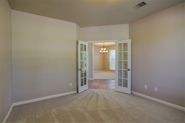 6103 Silver Thistle Ln, Fulshear, TX 77441 - unfurnished room with french doors, a chandelier, and carpet floors