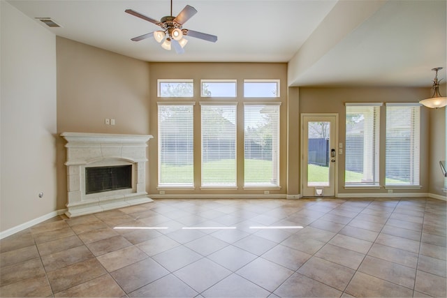 6103 Silver Thistle Ln, Fulshear, TX 77441 - unfurnished living room with a ceiling fan, tile patterned flooring, and a high end fireplace