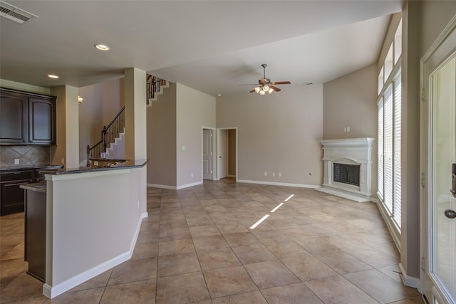 6103 Silver Thistle Ln, Fulshear, TX 77441 - kitchen featuring plenty of natural light, ceiling fan, tasteful backsplash, recessed lighting, and dark brown cabinetry
