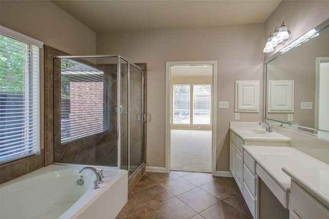6103 Silver Thistle Ln, Fulshear, TX 77441 - full bath featuring vanity, a shower stall, a bath, and tile patterned floors