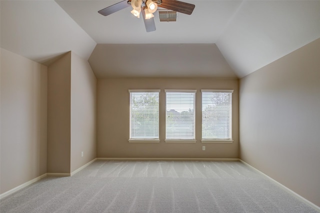 6103 Silver Thistle Ln, Fulshear, TX 77441 - empty room featuring vaulted ceiling, ceiling fan, and light colored carpet