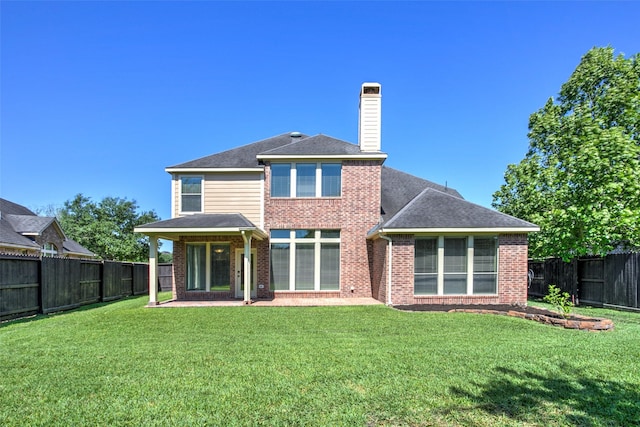 6103 Silver Thistle Ln, Fulshear, TX 77441 - back of property with brick siding, a fenced backyard, a chimney, and a shingled roof