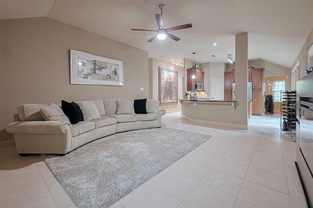 131 Breezy Shore Ct, Dickinson, TX 77539 - living area featuring a ceiling fan, baseboards, light tile patterned floors, and lofted ceiling