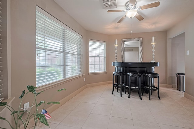 131 Breezy Shore Ct, Dickinson, TX 77539 - dining room featuring visible vents, a ceiling fan, baseboards, and light tile patterned floors