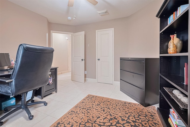 131 Breezy Shore Ct, Dickinson, TX 77539 - home office featuring ceiling fan, light tile patterned flooring, and visible vents