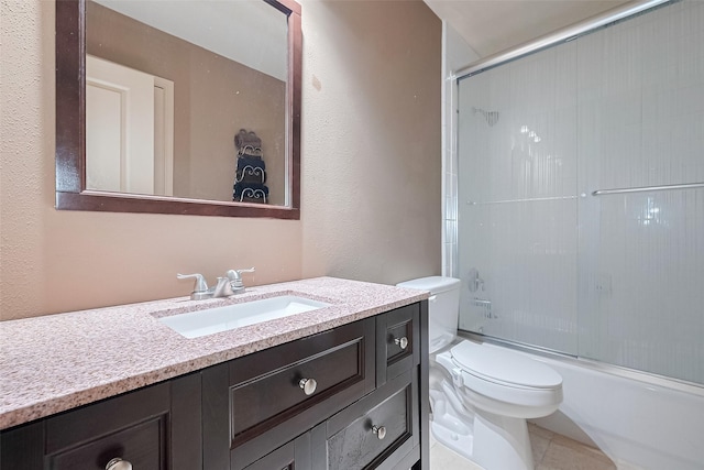 131 Breezy Shore Ct, Dickinson, TX 77539 - bathroom featuring vanity, a textured wall, enclosed tub / shower combo, and toilet