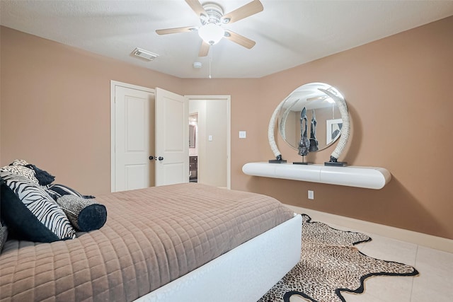 131 Breezy Shore Ct, Dickinson, TX 77539 - bedroom with baseboards, a ceiling fan, tile patterned floors, and visible vents