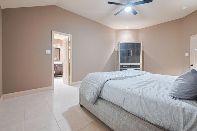 131 Breezy Shore Ct, Dickinson, TX 77539 - bedroom with ceiling fan, vaulted ceiling, light tile patterned floors, baseboards, and connected bathroom