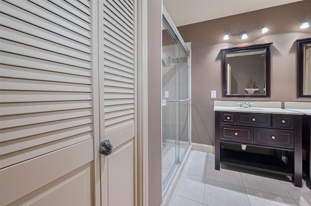 131 Breezy Shore Ct, Dickinson, TX 77539 - bathroom featuring a stall shower, tile patterned flooring, and vanity